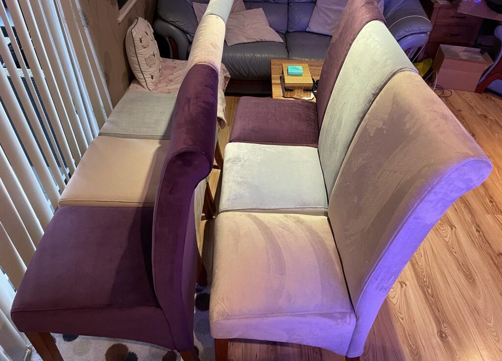 Fabric dining chairs showing visible upholstery cleaning patterns during a professional stain removal and cleaning service.