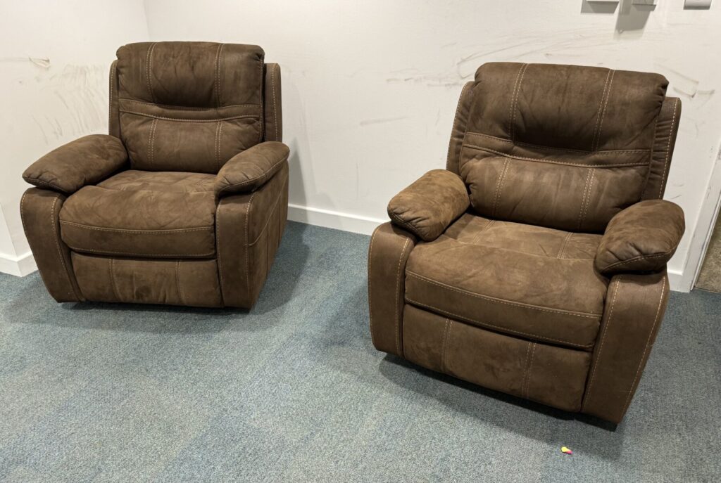 Pair of brown recliner armchairs showcasing professional upholstery repair and restoration services.