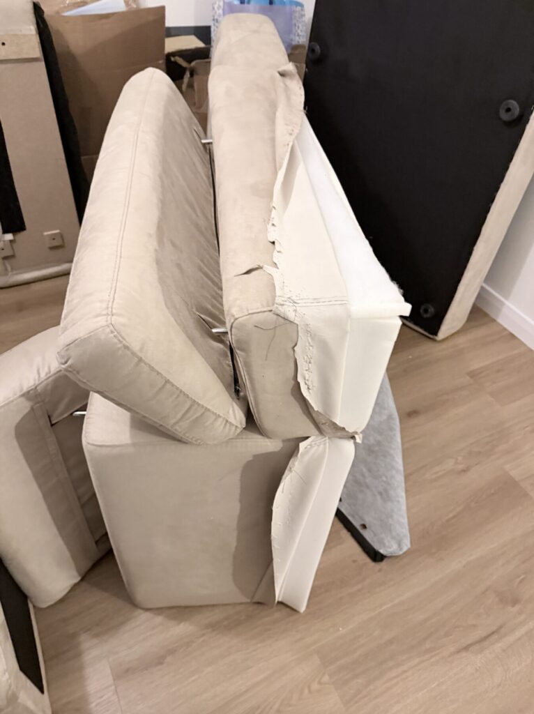 Chaise sofa partially dismantled during professional reupholstery and furniture restoration work.